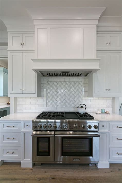 antique white cabinets with stainless steel hood over stve|white antique kitchen cabinets.